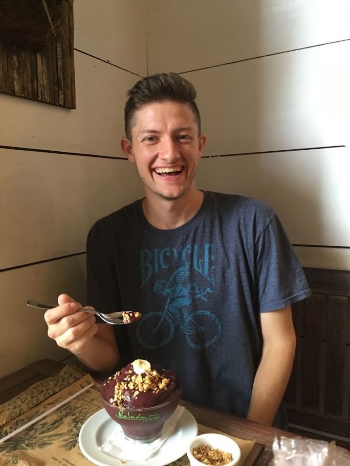 Seth eating dessert in a restaurant. 