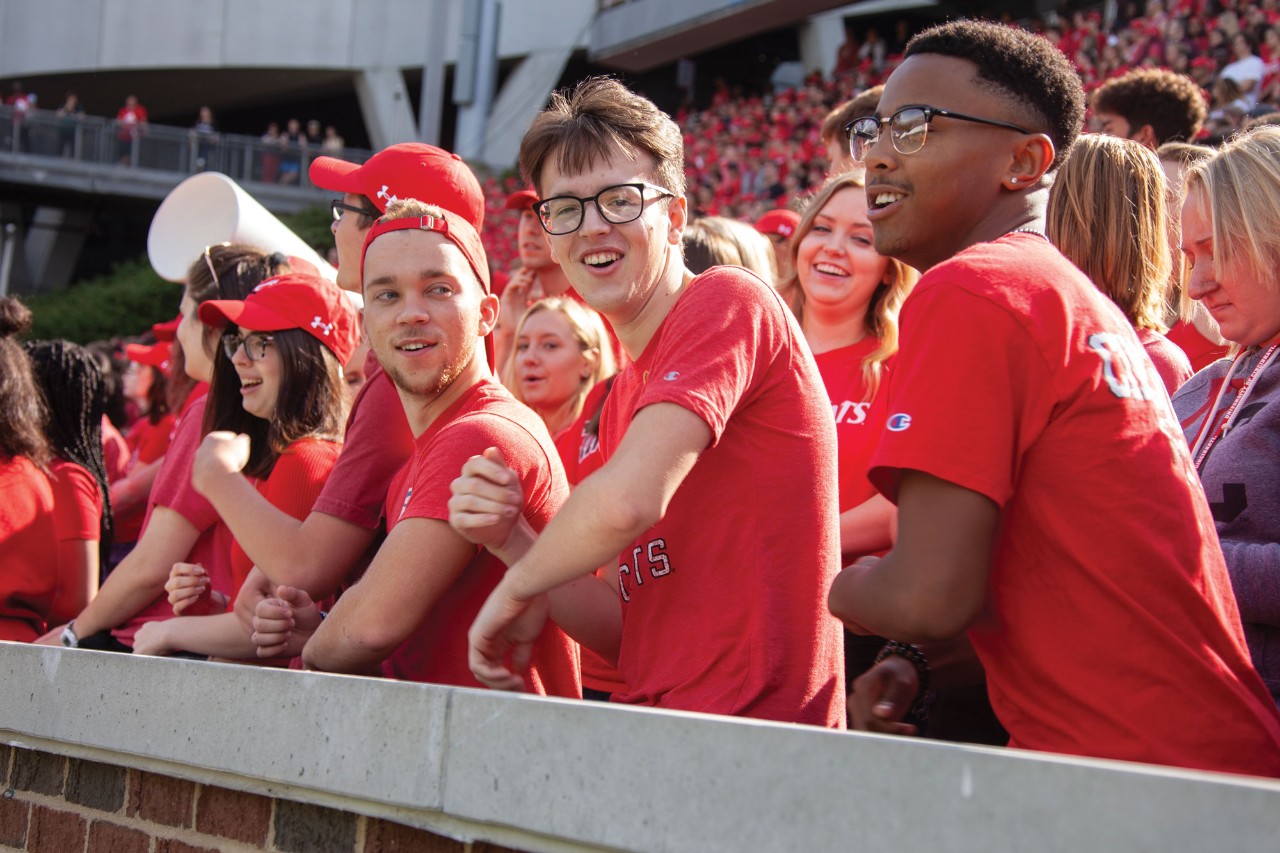 Students cheering at Nippert Stadium.